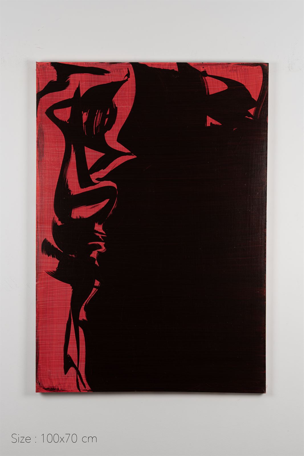 Black calligraphic mass over a red cross-hatched ground